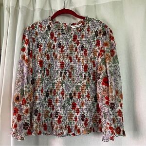 Veronica Beard Kali smocked blouse. Long sleeve with smocked bodice and cuffs.